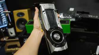 Person holding a GTX 1070 founder's edition graphics card
