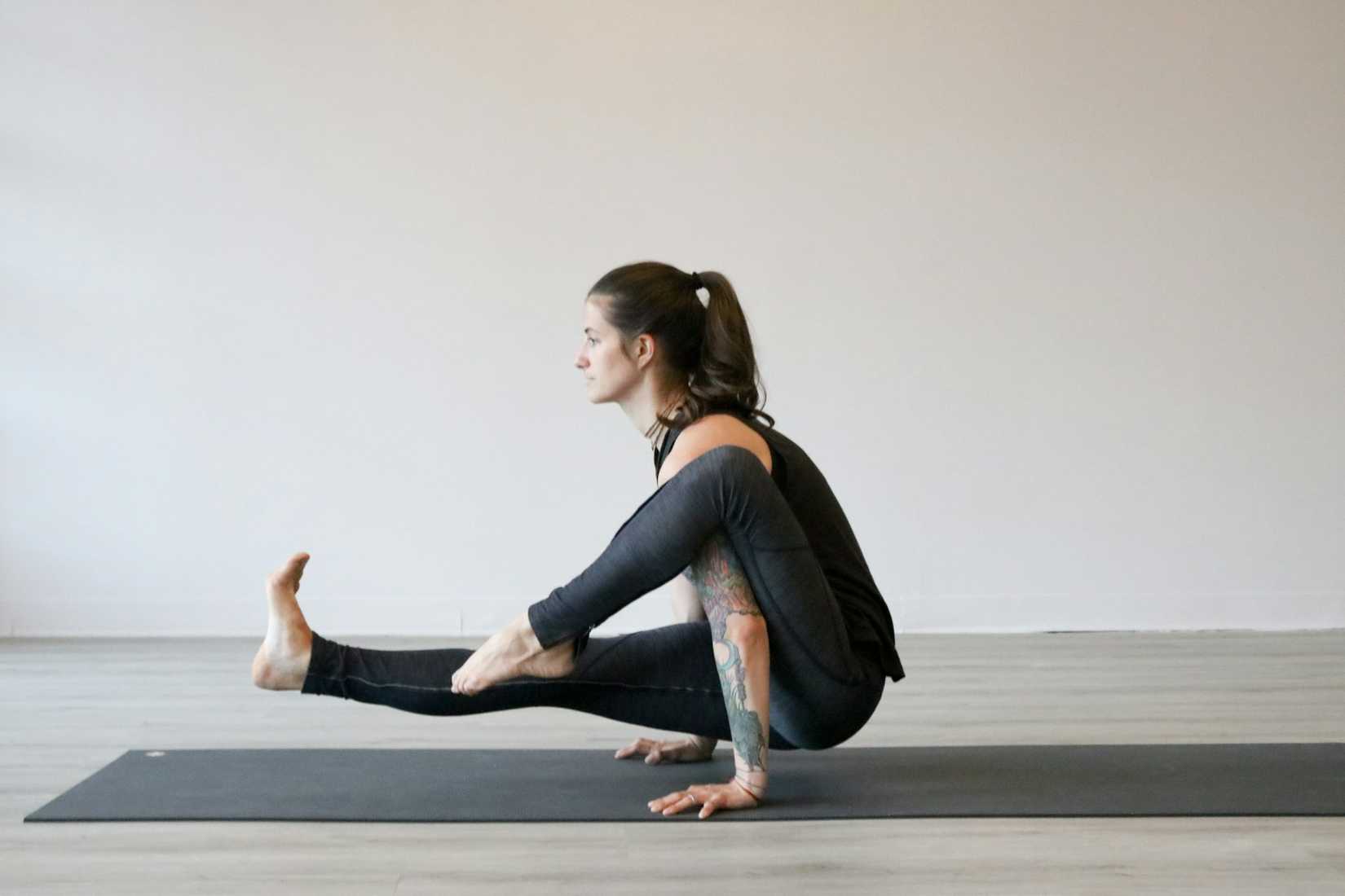 A woman stretching on a yoga mat