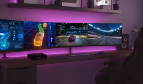 Asus ROG NUC on desk with two ultrawide monitors