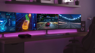 Asus ROG NUC on desk with two ultrawide monitors