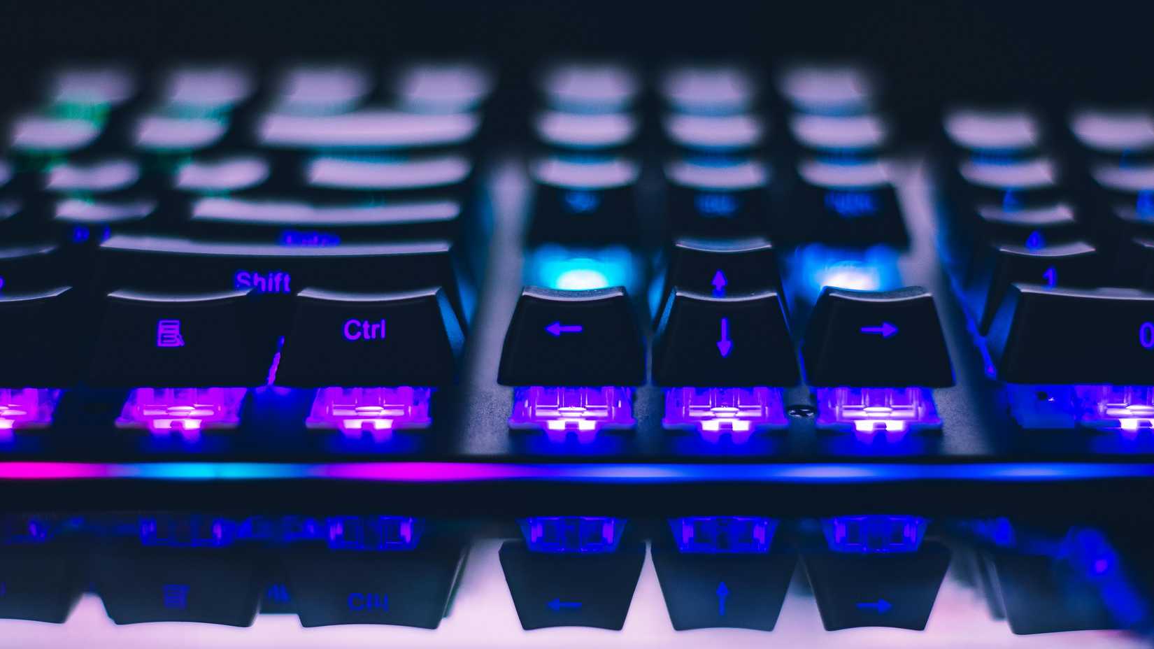 Side view of a keyboard showing side-printed keycaps with RGB lighting