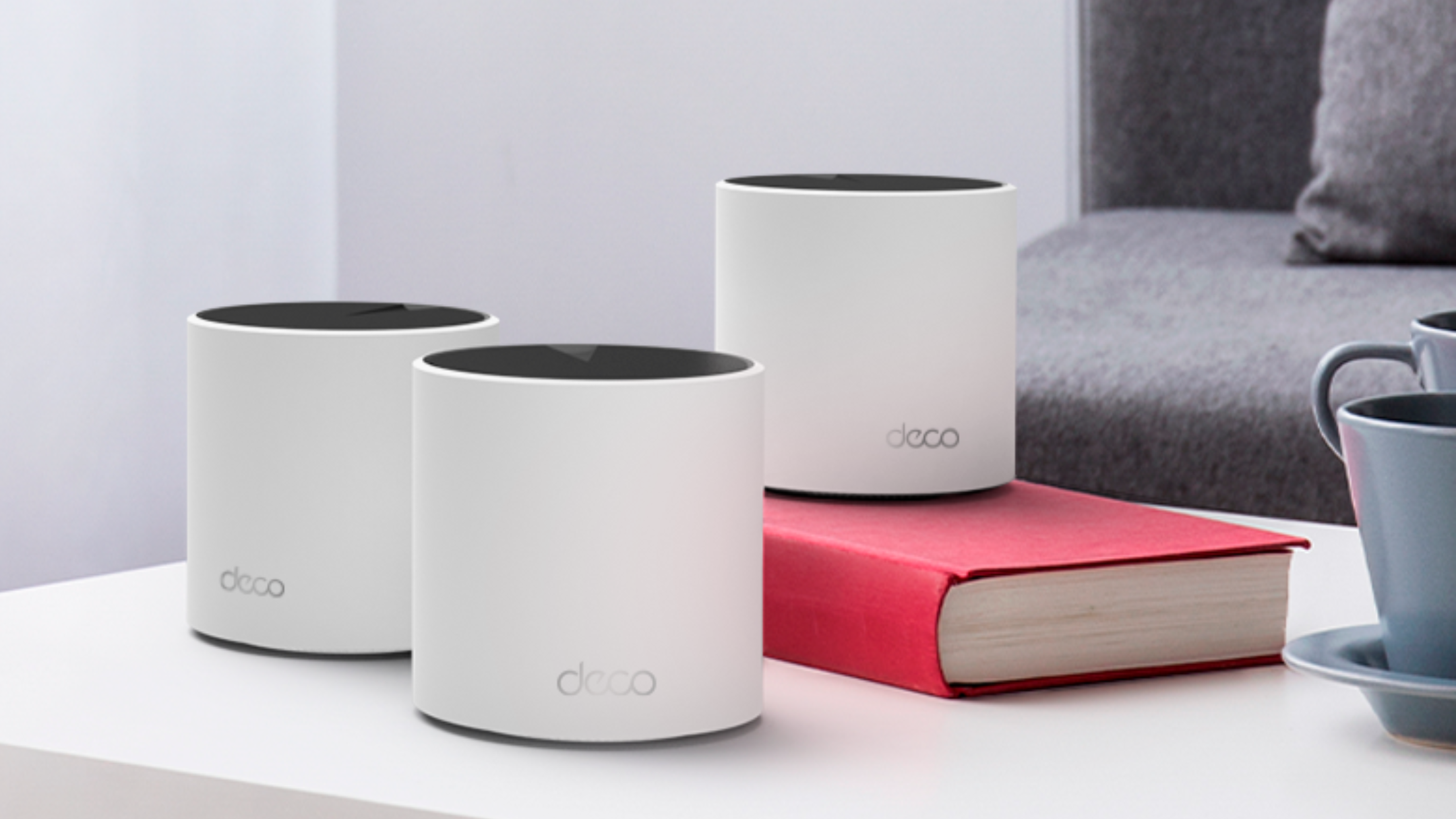 TP-Link Deco X55 mesh system on table
