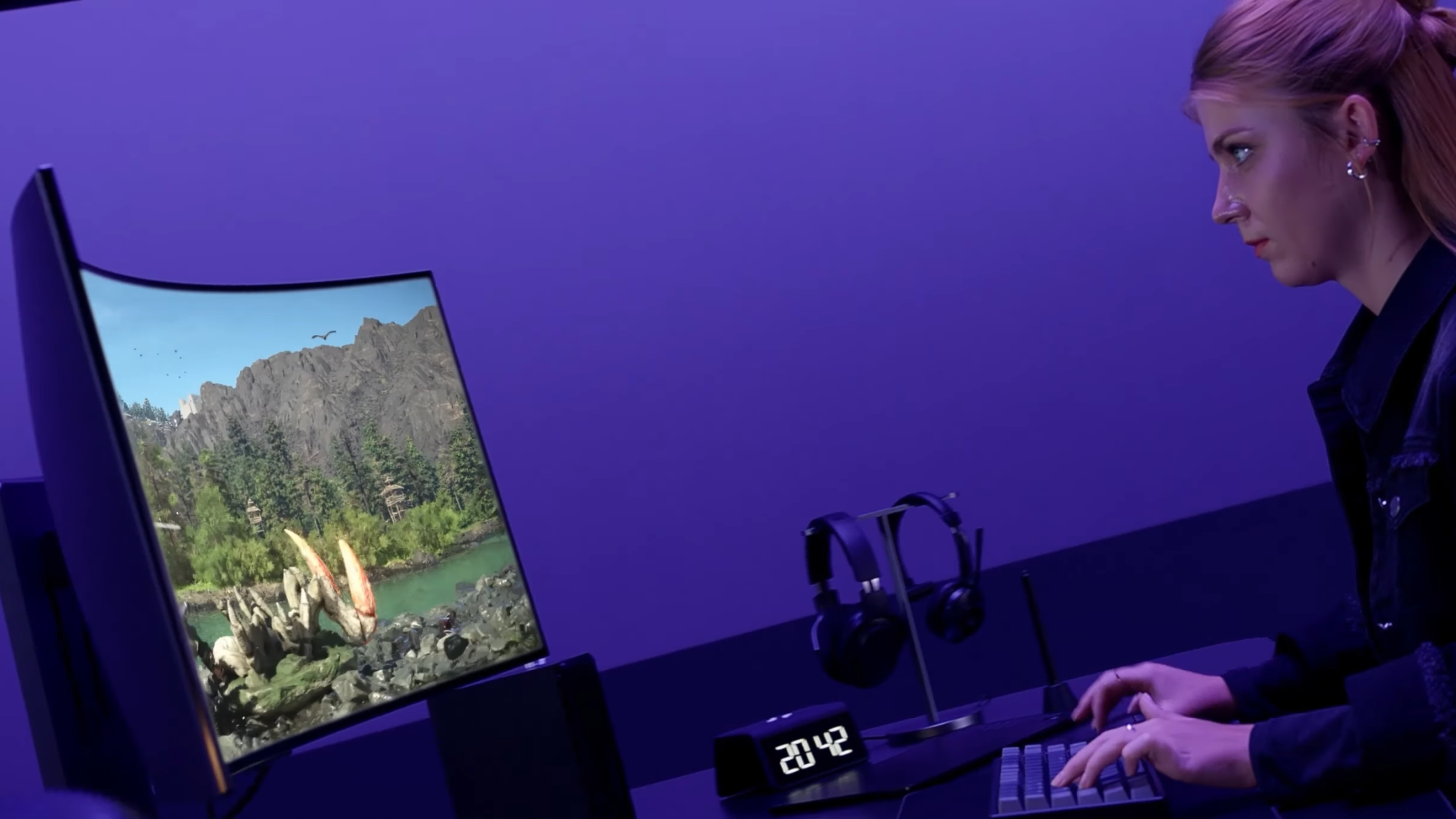 Person gaming on LG UltraGear 39GS95QE monitor