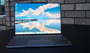 An image of a Lenovo ThinkBook 13x G4 open on black tabletop