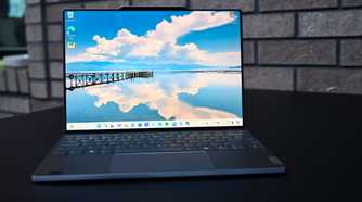 An image of a Lenovo ThinkBook 13x G4 open on black tabletop