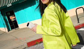Woman holding a Porcelain Google Pixel 9 Pro in her hand