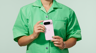 Woman holding a Rose Quartz Google Pixel 9 Pro in both hands showing the back of the phone