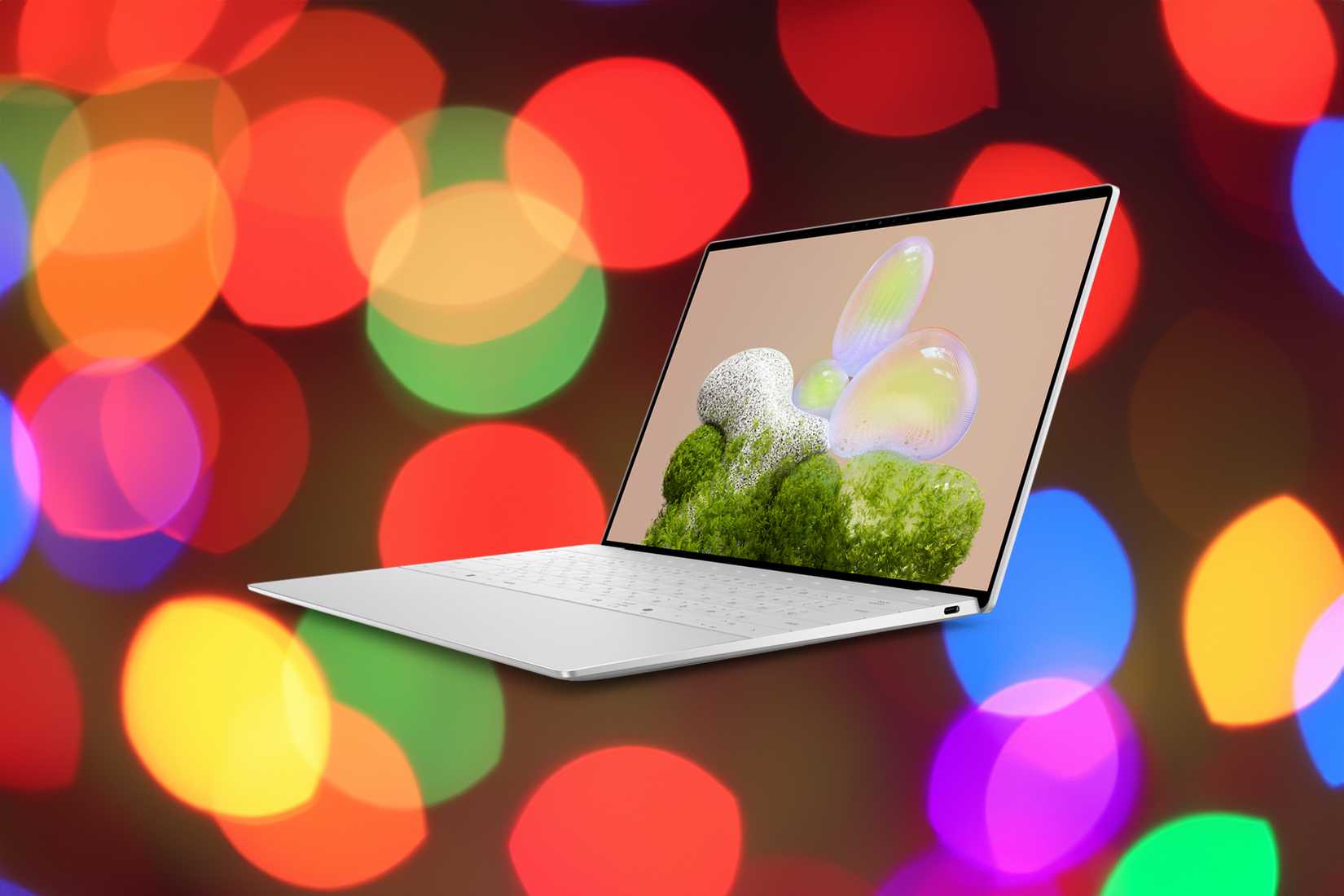 Angled view of a Dell XPS 13 over colored lights