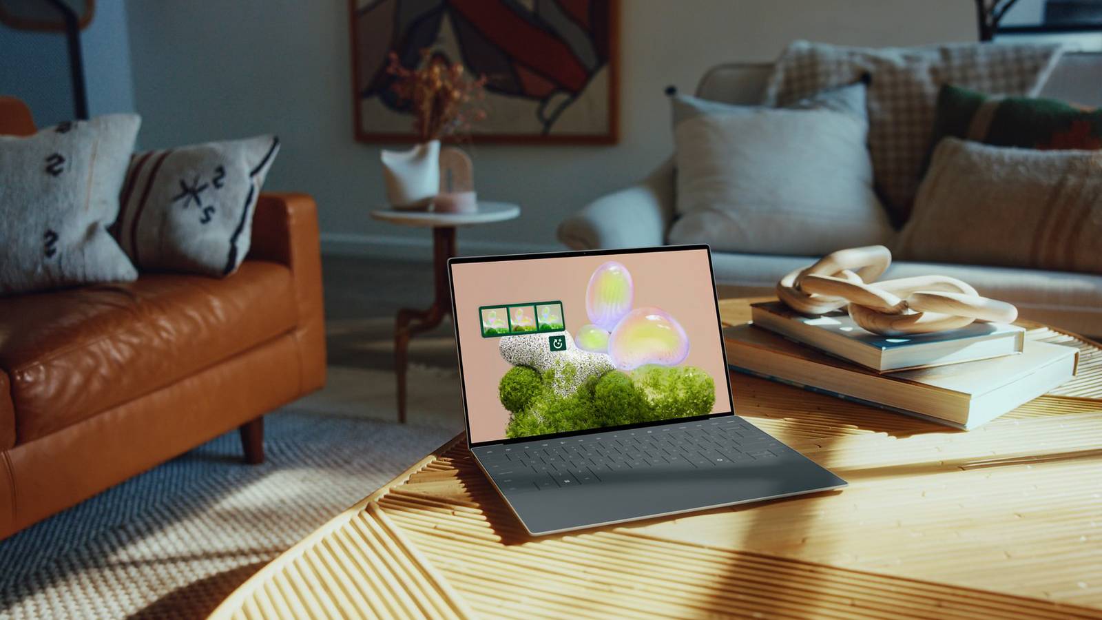 A graphite Dell XPS 13 on a wooden table