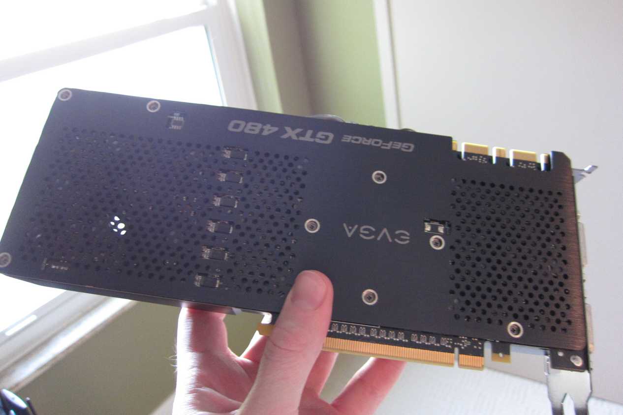 An old Nvidia graphics card in a person's hand