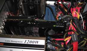 Inside of a gaming PC showing an Nvidia graphics card, power supply, and CPU cooler