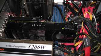 Inside of a gaming PC showing an Nvidia graphics card, power supply, and CPU cooler