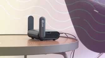 small wifi router on a table with representation of wireless data flowing through the air