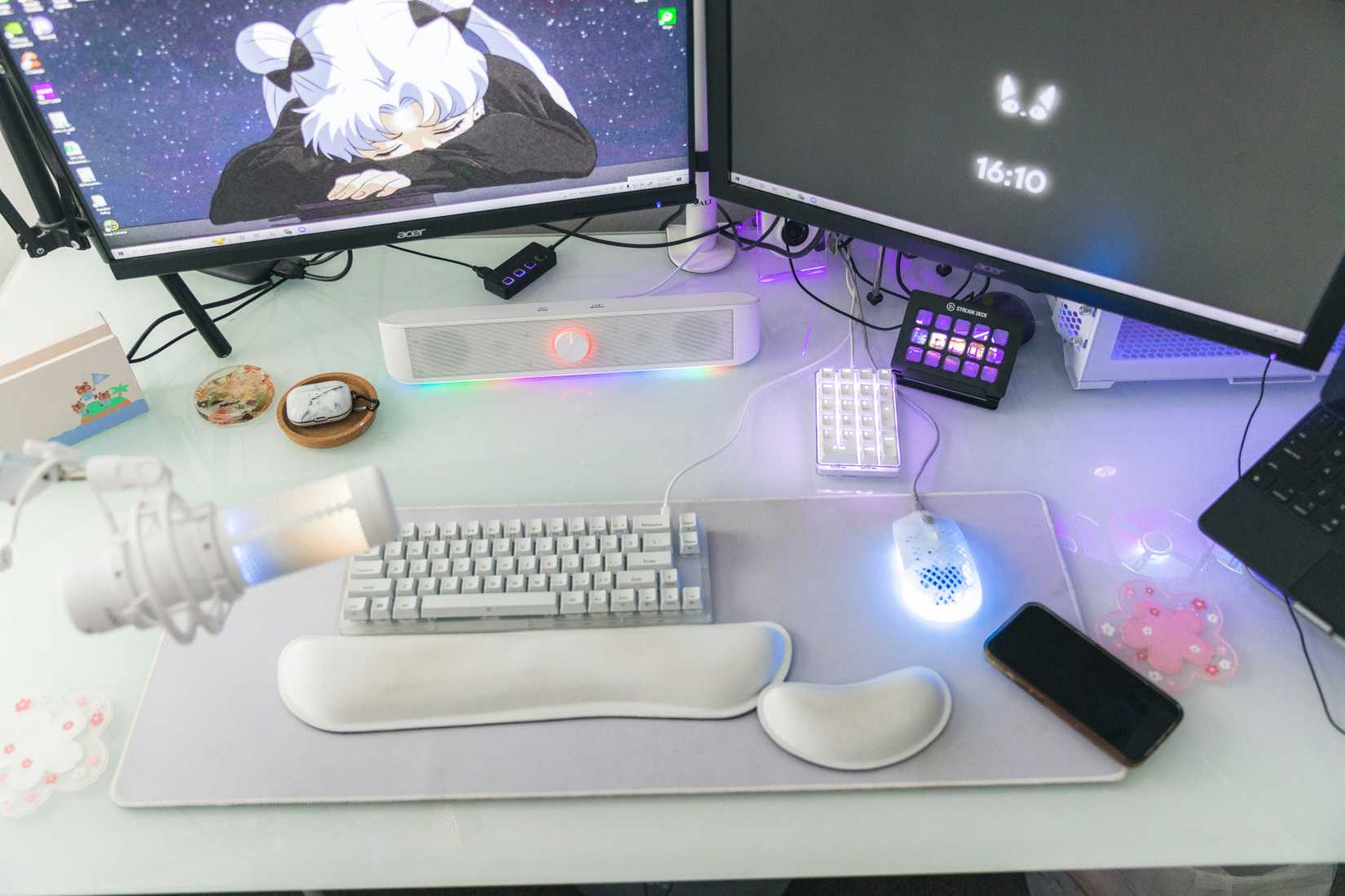 A full streamer setup with multiple monitors and a Stream Deck.