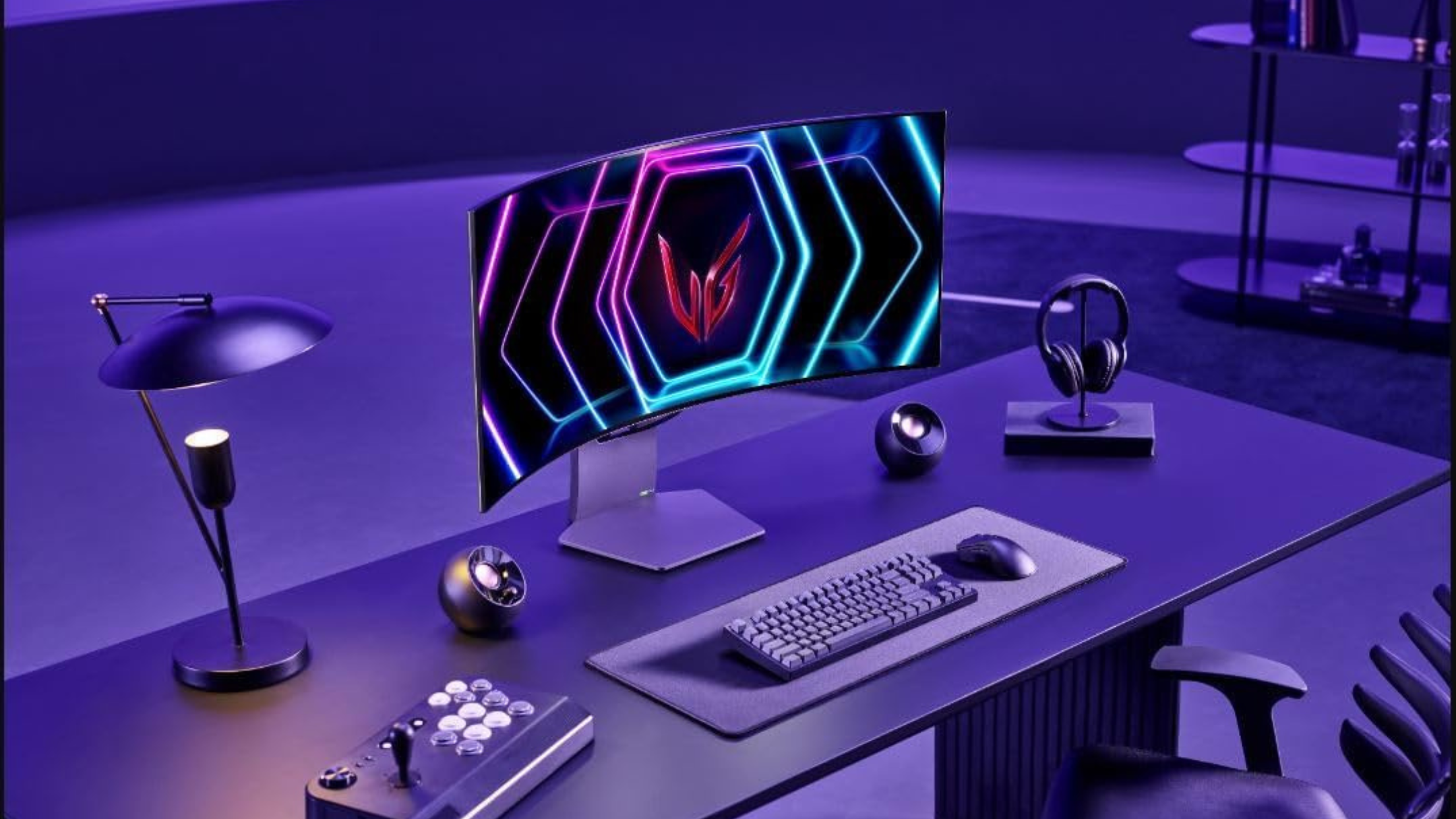 LG 39GS95QE Ultragear OLED Curved Gaming Monitor on desk with keyboard and speakers