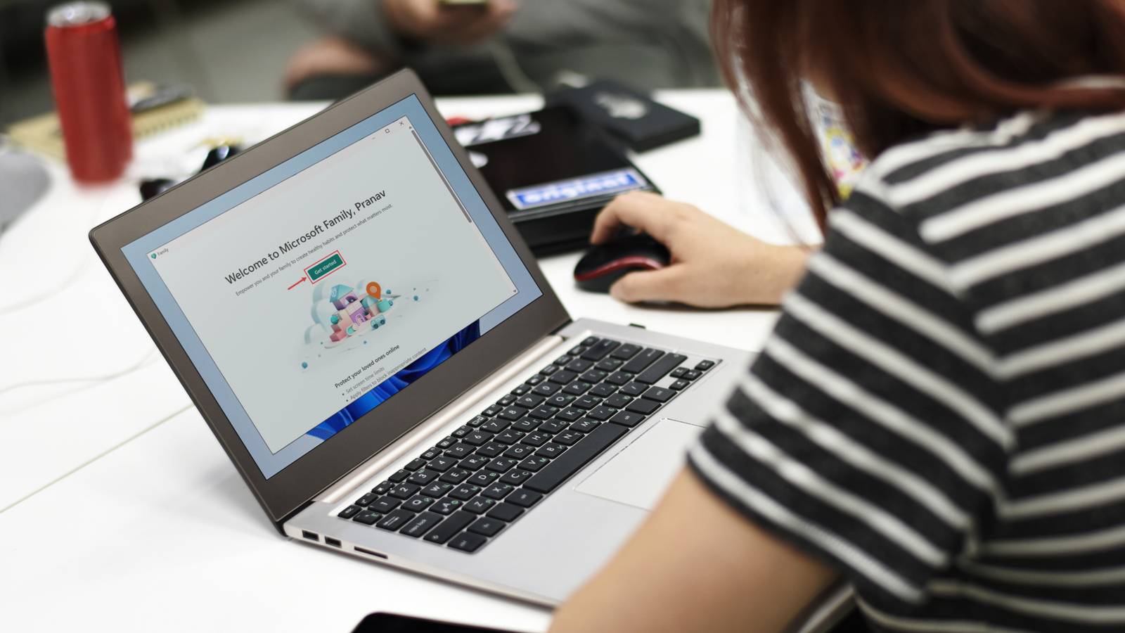 person using Windows laptop with Family app opened