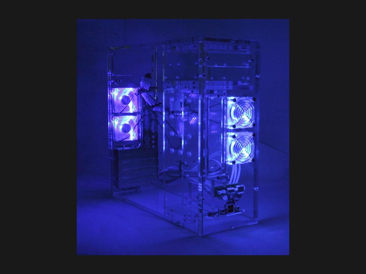 A clear PC case with some small blue fans