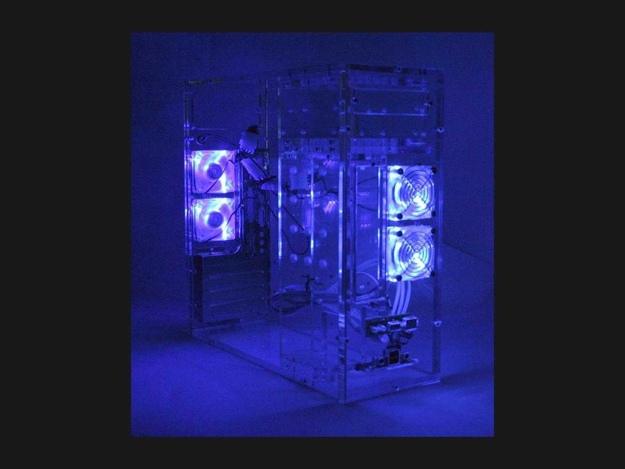 A clear PC case with some small blue fans