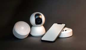 Several devices including a smartphone, webcam