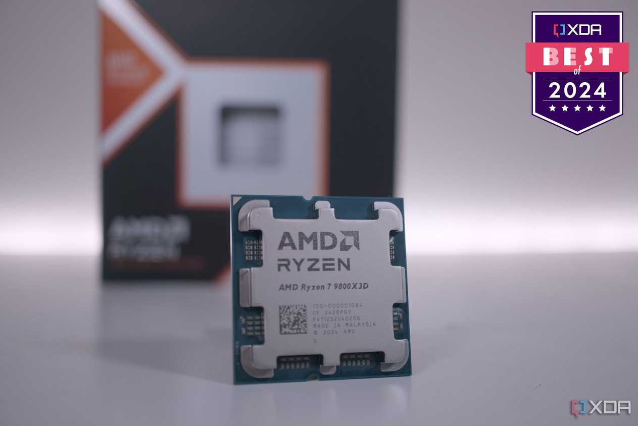 AMD Ryzen 7 9800X3D on a white surface with a badge reading XDA Best of 2024