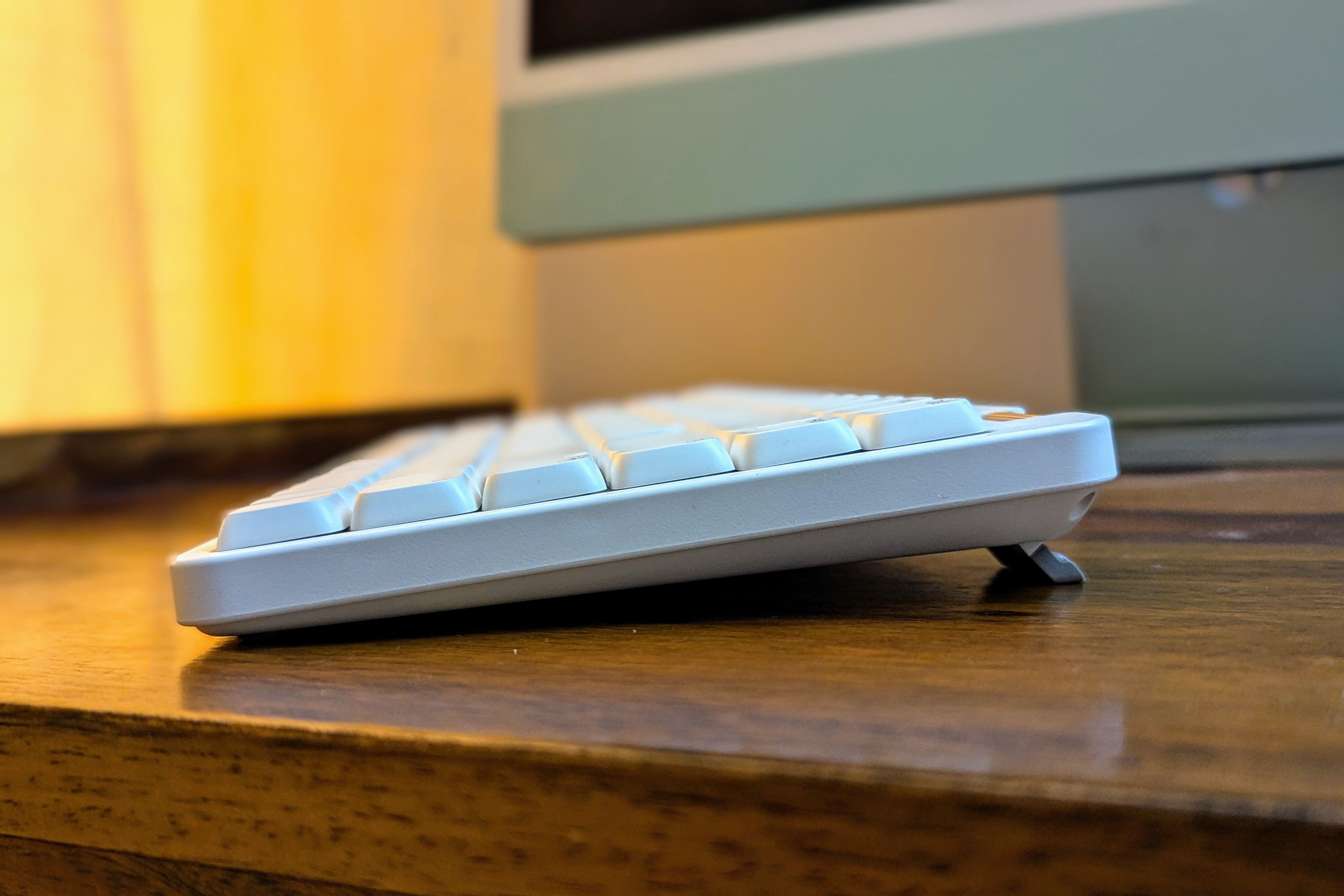 Side view of a white low-profile mechanical keyboard