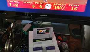 Super Noah's Ark 3D in a SNES with a licensed game cartridge attached