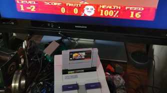 Super Noah's Ark 3D in a SNES with a licensed game cartridge attached