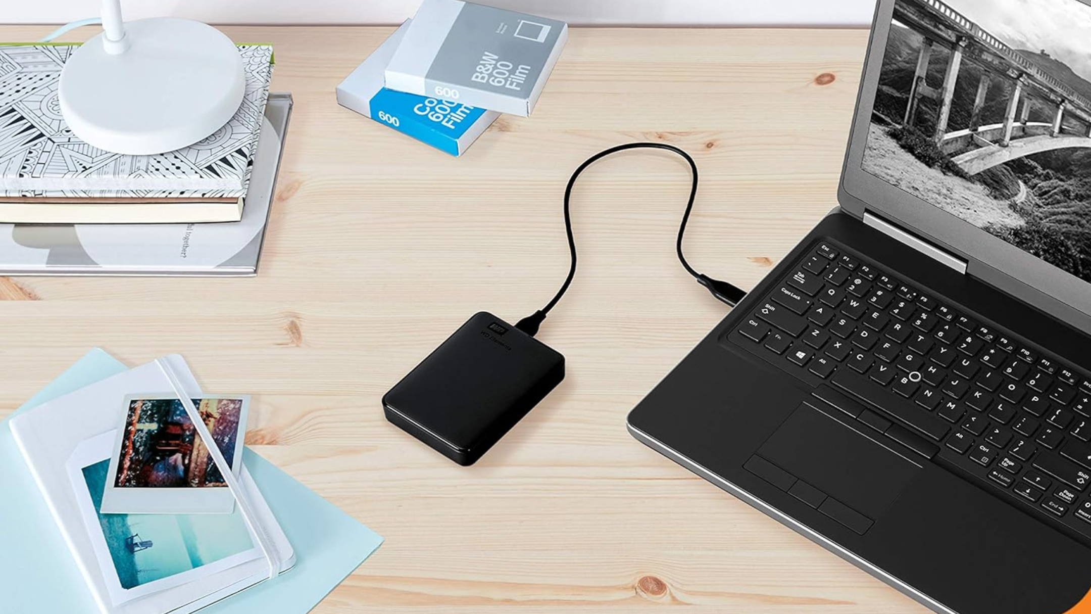 WD 5TB Elements Portable External Hard Drive attached to a laptop on a desk