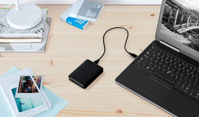 WD 5TB Elements Portable External Hard Drive attached to a laptop on a desk