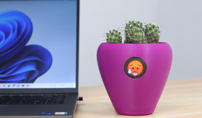 A purple flower pot with a hot emoji on it