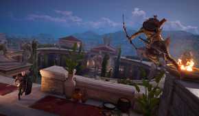 Bayek jumping from a ledge and aiming a bow at a soldier with a shield