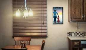 dakboard smart display mounted on a kitchen wall