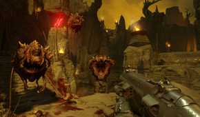 Screenshot from DOOM (2016) video game with three floating demon enemies pursuing player character in hellish environment