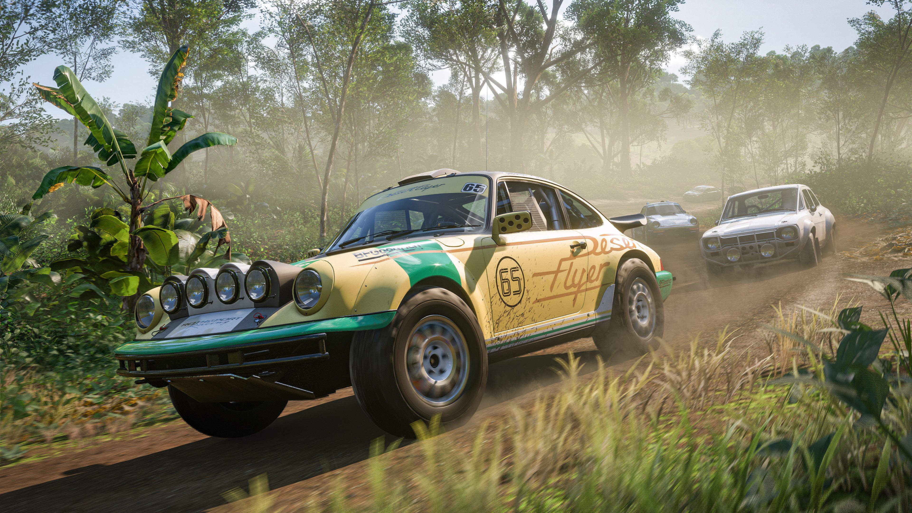 Screenshot from Forza Horizon 5 video game of cars racing in forest setting