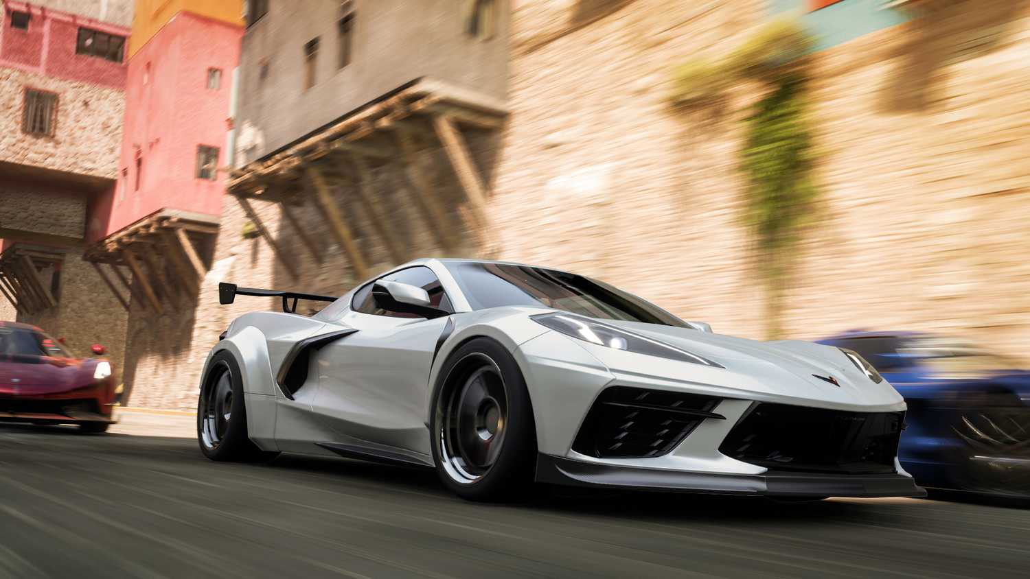 Screenshot from Forza Horizon 5 video game of cars racing on paved road