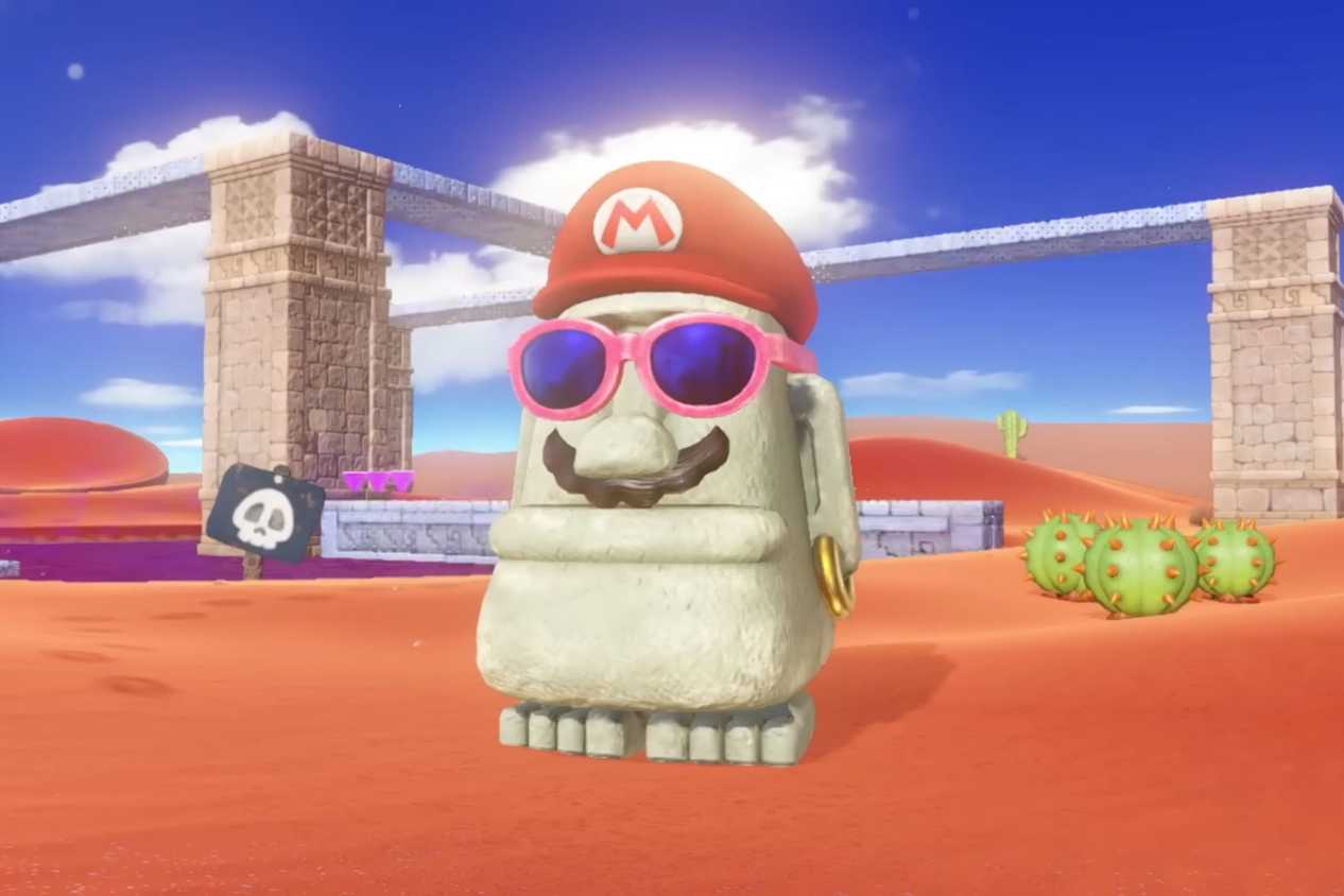 Super Mario Odyssey Mario hat and mustache on statue in the desert