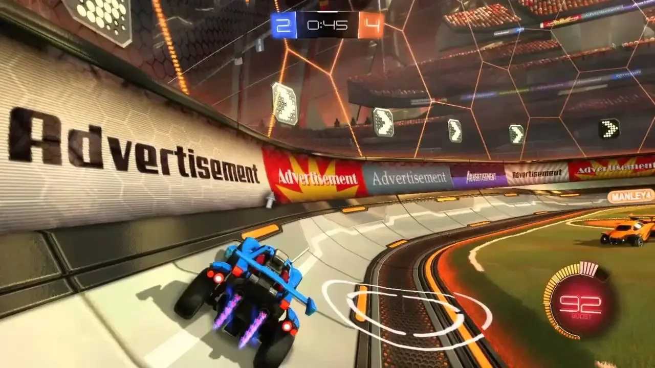 Screenshot from Rocket League video game of car driving in arena