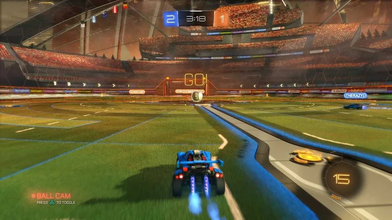Screenshot from Rocket League video game of car driving towards large ball in arena