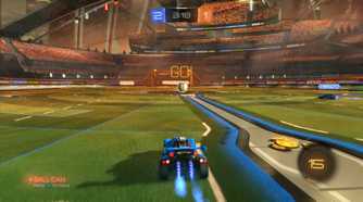 Screenshot from Rocket League video game of car driving towards large ball in arena