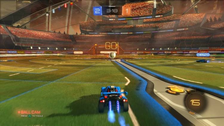 Screenshot from Rocket League video game of car driving towards large ball in arena