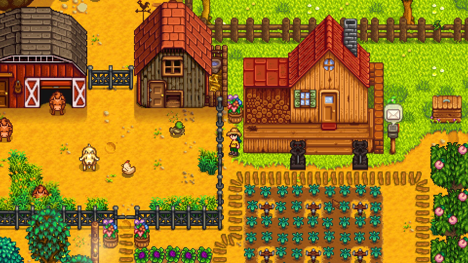 fenced-in animals on a farm with crops around them.
