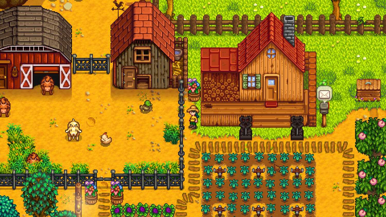 fenced-in animals on a farm with crops around them.