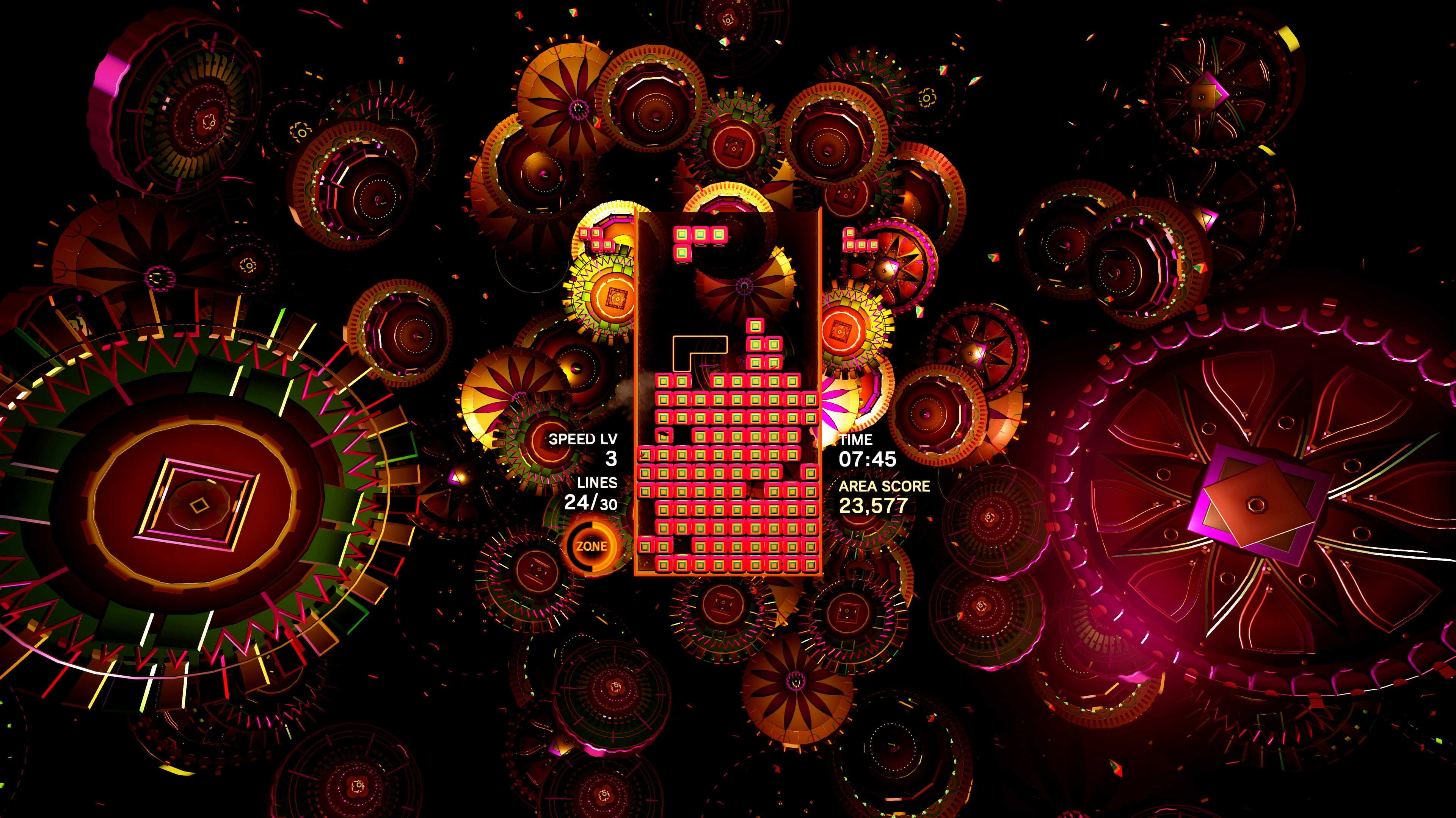 Screenshot from Tetris Effect video game of Tetris board surrounded by brightly coloured rings
