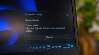 A Windows Security notification showing the Microsoft Defender Antivirus catching threats.