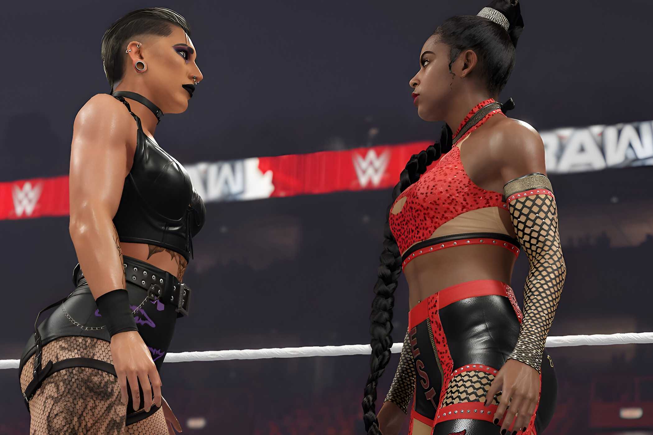 A screenshot from WWE 2K23, showing Rhea Ripley, sporting an all-black outfit, face off against Bianca Belair, wearing red and black.