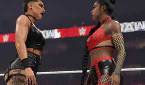 A screenshot from WWE 2K23, showing Rhea Ripley, sporting an all-black outfit, face off against Bianca Belair, wearing red and black.