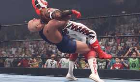 A screenshot from WWE 2K23, showing Kurt Angle, the bald wrestler, hit Rey Mysterio in the white tights, with a German Suplex.