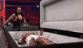 A screenshot from WWE 2K24, showing the Undertaker, wearing a black vest and tights, look over Shawn Michaels who is laying inside a white-lined casket.
