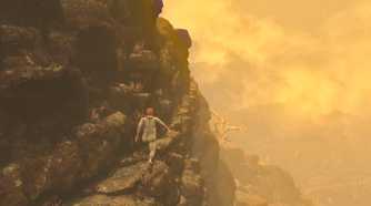 Screenshot from Baby Steps video game of man walking on the side of a mountain.