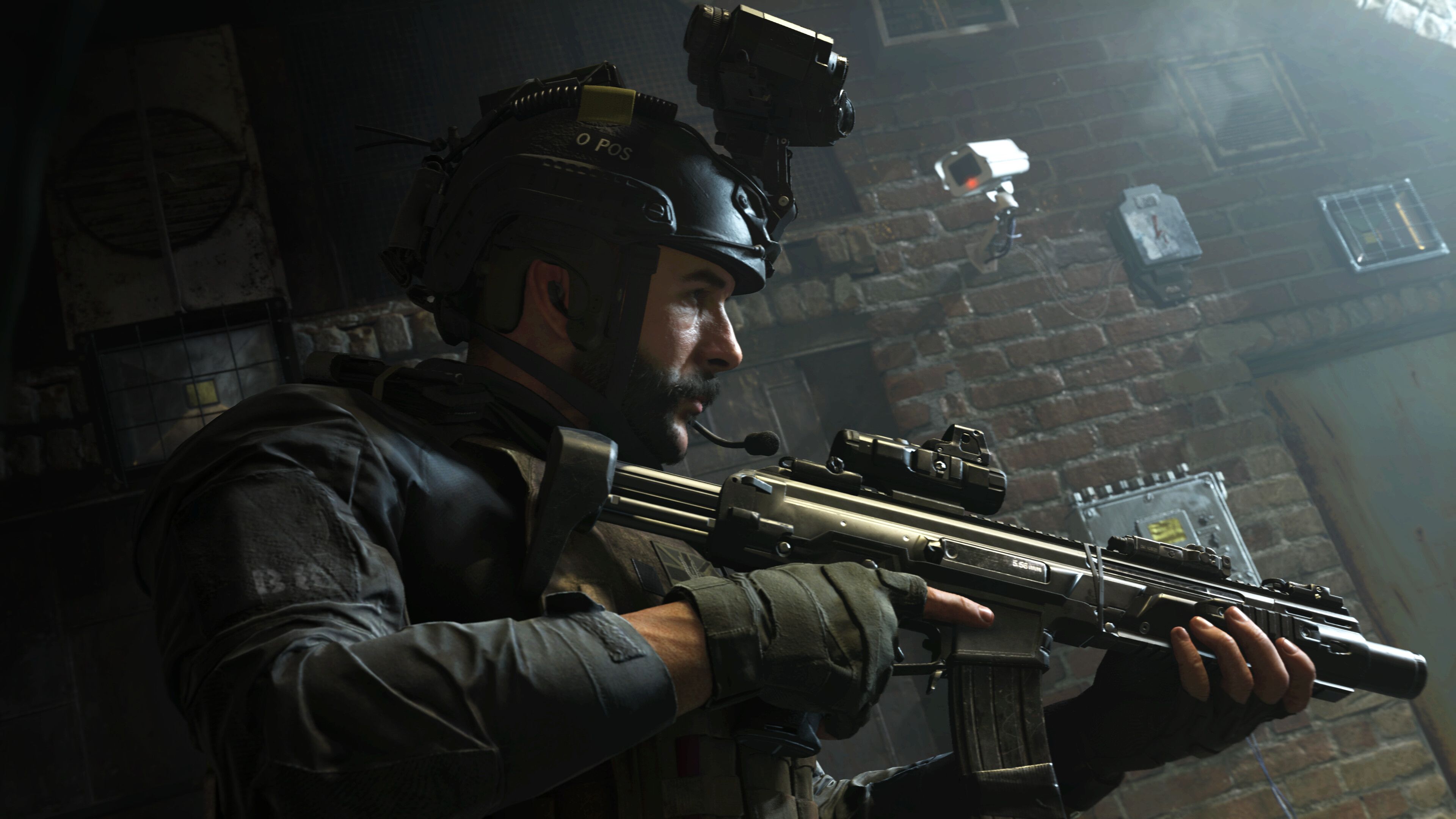 Screenshot from Call of Duty: Modern Warfare (2019) video game of armed soldier in dark alleyway